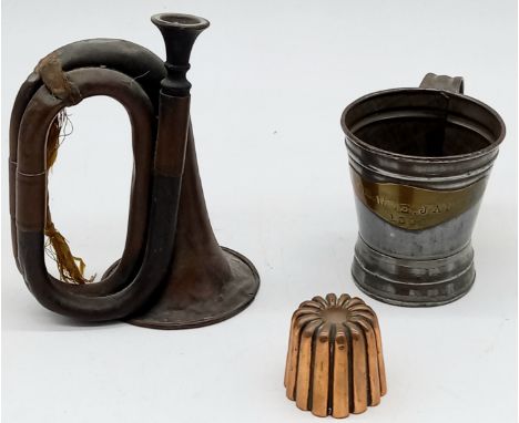 A Victorian child's copper bugle, a copper aspic jelly mould, and a tin tankard dated 1892 and inscribed "For Wee Janet"