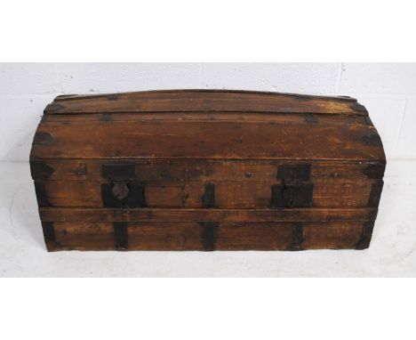 An antique pine metal-bound dome topped trunk with wrought iron handles - length 76cm, depth 41cm, height 33cm