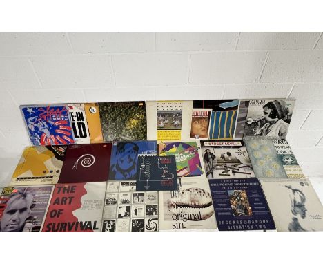An assortment of vintage record label 12" vinyl compilations including Creation Records - I Love the Smell of Napalm and Doin