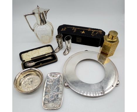 A collection of assorted silver-plated items to include, claret jug, cased spoon, pair of boots, a oriental brass tea caddy e