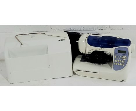 A brother computerized sewing machine, with operation manual. product code 885-U22.