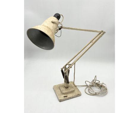 A vintage cream Herbet Terry Anglepoise lamp on stepped base 