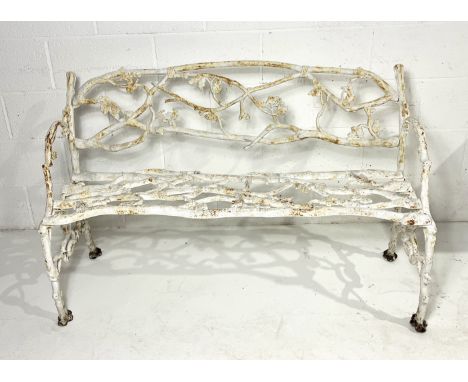 A Victorian painted cast iron oak tree pattern garden bench, the backrest, seat, arms and legs naturalistically cast as branc