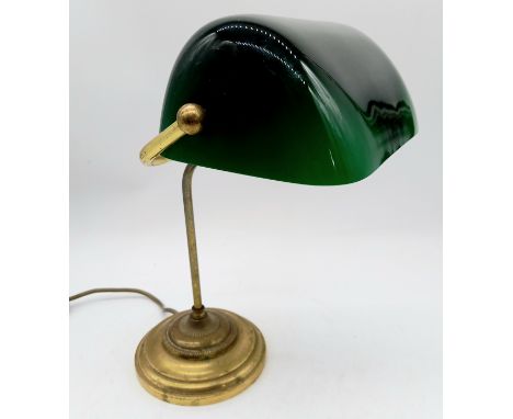 A vintage banker's lamp with green glass shade. 