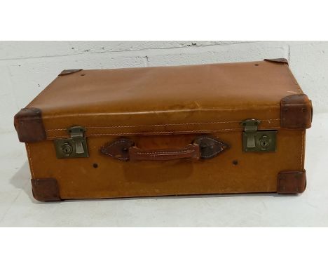 A vintage leather suitcase by Smith's Trunk stores Bloomsbury, contains various patterns, materials and sewing magazines etc.