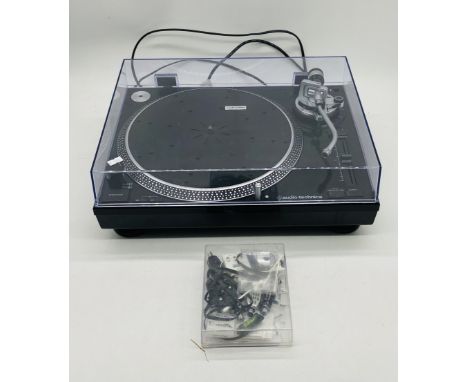 An audio-technica AT-LP 120-USB Direct Drive Professional Turntable with instructions (untested) with accessories including s