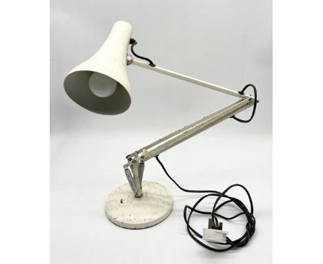 A vintage white Anglepoise Lighting Ltd model 90 desk lamp on circular base