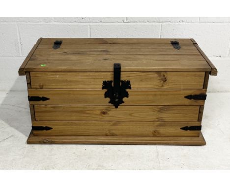 A modern pine trunk with ironwork detail - 49cm x 91cm x 42cm 