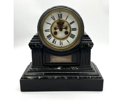 An antique slate mantle clock with presentation plaque reading "presented to E. Durham by Capt. Kinglake as a token of his re