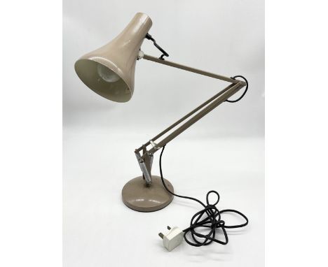 A vintage Anglepoise Lighting Ltd model 90 desk lamp on circular base