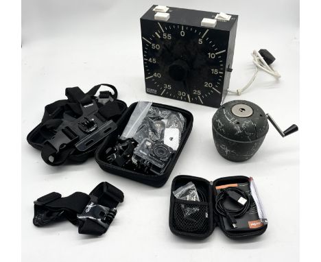 A Rollei Actioncam 4s Plus with various accessories along with a Hauck Polychron studio timer and a vintage Velos Success tab
