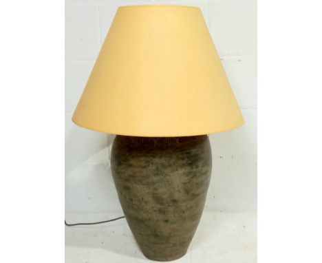 A contemporary pottery lamp base decorated with lotus leaf pattern with conical shape parchment shade, 90cm high to include s
