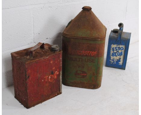 A weathered vintage AgriCastrol oil can, along with an Esso Blue Valor can and a Shell Motor Spirit can