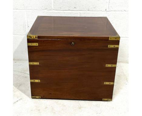 A Victorian brass bound mahogany R. Wiss campaign commode with lift up lid enclosing original blue and white interior, transf