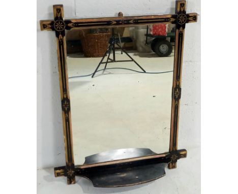 An Aesthetic movement ebonised and gilded framed wall mirror with shelf to base, 61cm wide, 76cm high.