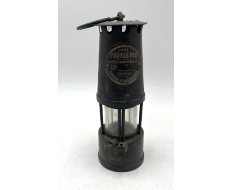 A Miner's Lamp by 'The Protector Lamp and Lighting Co. Ltd, Eccles' - 24cm high