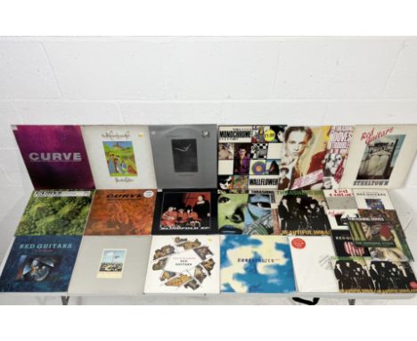 A collection of mostly 12" vinyl records including The Monochrome Set albums Strange Boutique and Love Zombies along with 12"