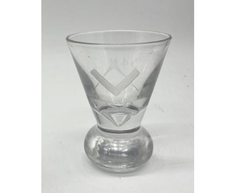 A Masonic firing glass on circular base with etched square and compass motif to one side and "340" to the other
