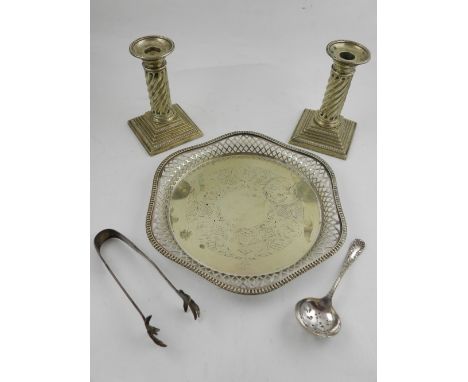 A quantity of silver plated items, to include salver, ladle, and sugar tongs. (3)