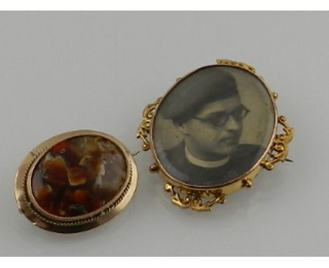 A yellow metal mounted double photo portrait brooch, together with a yellow metal and agate jasper brooch. (2)