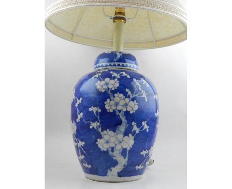 A 20th century Chinese blue and white ginger jar and cover, converted as a lamp, with cream shade. 