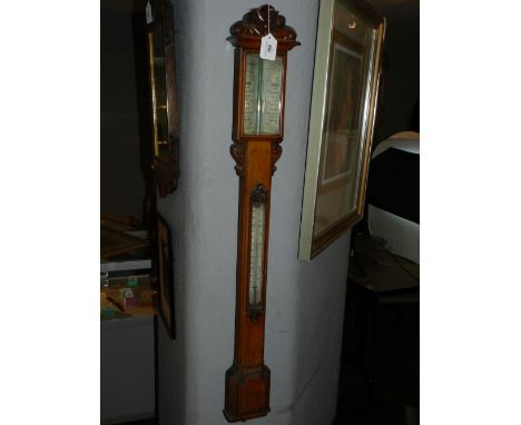 L. Casella, London. A 19th century oak wall barometer. H: 106cm