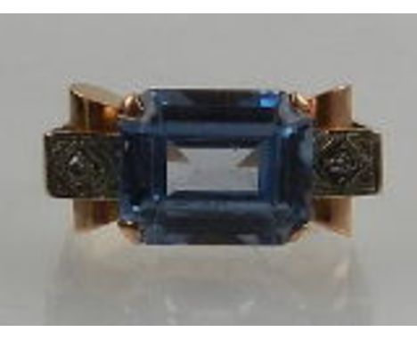 A yellow gold, diamond, and aquamarine set cocktail ring. 