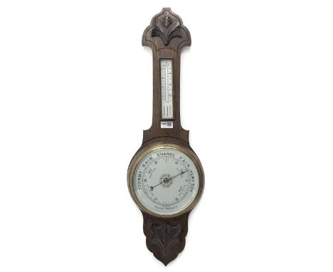 Early 20th century oak barometer, shaped pediment with foliage carved mount, mercury thermometer and aneroid barometer, H82cm