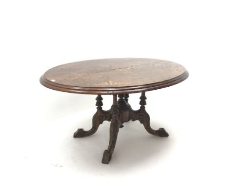 Victorian inlaid oval tilt top table, quadruple turned support with central finial on four acanthus carved outsplayed support