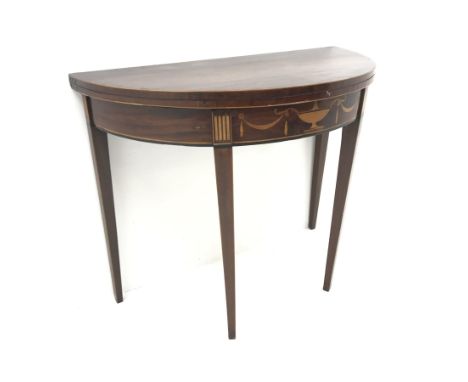 George III Sheraton period mahogany demi-lune card table, the frieze inlaid with urn and swags, fold over baize lined top wit