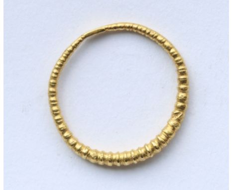 An Anglo-Saxon or Viking gold finger ring, 10th-11th Century, ribbed graduated band with pressed ends, 2.49g, internal diamet