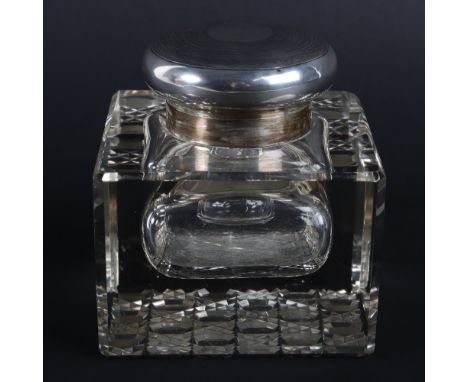 An early 20th century large silver and glass inkwell, London 1924, engine turned lid, 10cmWx10cmDx10cmH