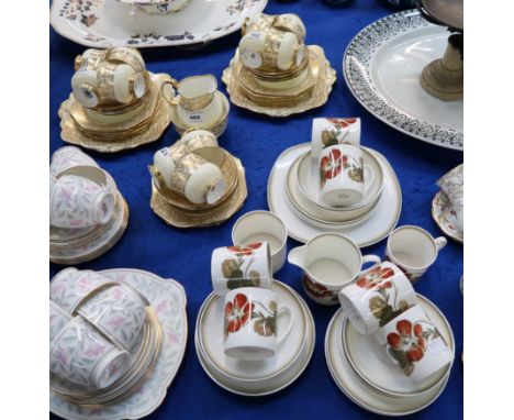 A Paragon cream glazed teaset with gilt leaf decoration comprising eleven cups, twelve saucers, ten plates, two cake plates, 