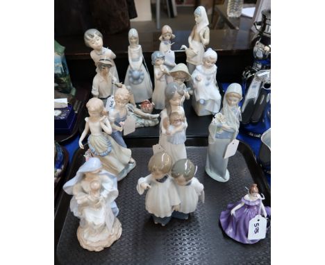 Lladro figure of choir boys, and a lady holding lilies, together with assorted Nao and other Spanish figures Condition Report
