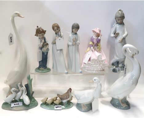 A collection of Nao figures including children, geese and a hen with chicks, together with another figure of a lady Condition
