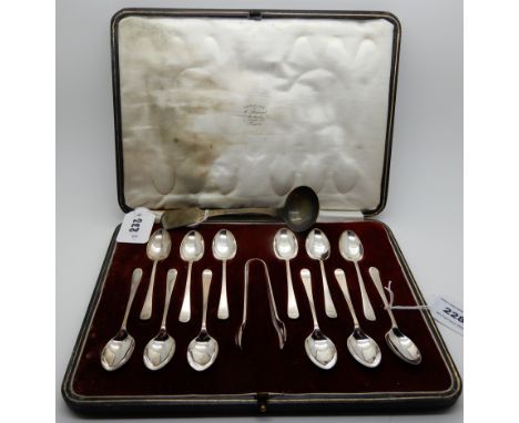 A lot comprising a cased set of twelve silver coffee spoons with tongs, Sheffield 1922 and a sauce ladle Condition Report: Av