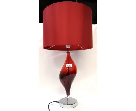 A red glass and chrome table lamp with shade Condition Report: Available upon request