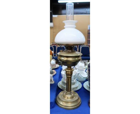 A brass oil lamp with white glass shade Condition Report: 70cm high including funnel. 