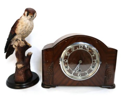 A Pendragon Crafts model of a falcon and a wooden mantle clock Condition Report: Available upon request