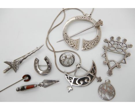 A silver Ola Gorie pendant, two Robert Allison brooches, a James Fenton agate set trowel, Shetland silver pendant etc Conditi