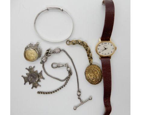 A silver bangle, white metal Albertina, cross shaped locket, a Victorian coin dated 1887 enamelled verso etc Condition Report