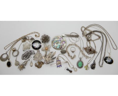 A collection of silver and white metal items to include a silver Ward Brothers leaf brooch, a silver and enamel Veritas brooc