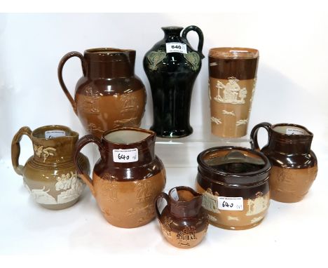 Three graduated Royal Doulton stoneware jugs, a Doulton Lambeth mug (def), a glazed flask marked for James Burrough Ltd (def)