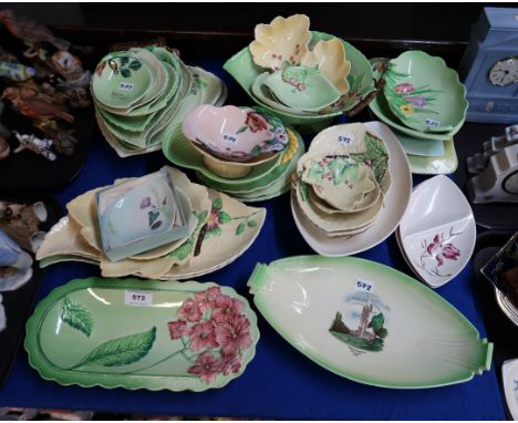 A collection of Carlton Ware dishes and plates including hydrangea, dog rose, magnolia, apple, foxglove etc and a Empire Exhi