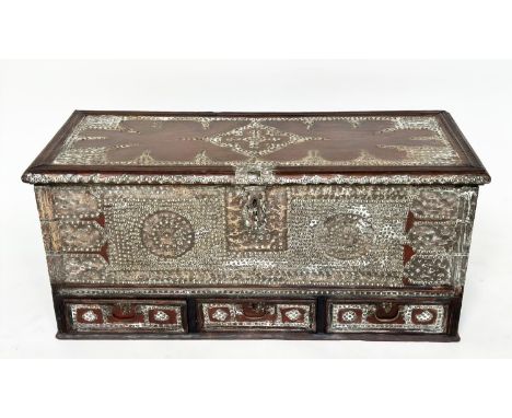 ZANZIBAR TRUNK, 19th century East African teak and profusely brass inset with rising lid and three base drawers, 101cm W x 44