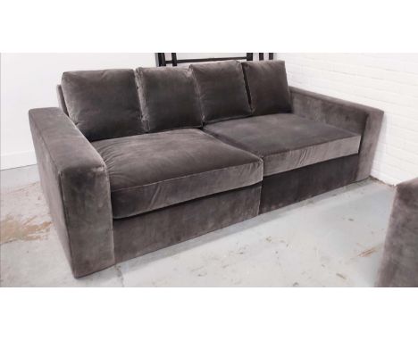 SOFA, grey velvet upholstered, 325cm W x 115cm D, in two sections.