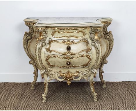 BOMBE COMMODE, 18th century style Venetian cream and gilt decorated with inset mirrored top, above two drawers, 83cm H x 100c
