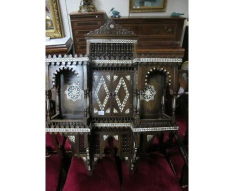 A MOORISH STYLE WALL CABINET of inverted breakfront outline with central cupboard flanked on each side by open shelves betwee