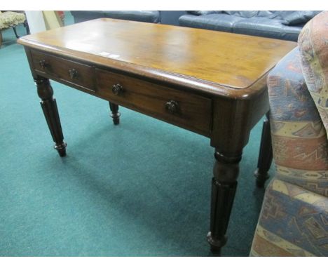 A WILLIAM IV MAHOGANY LIBRARY TABLE the shaped moulded top above two frieze drawers on lobed and ring turned legs stamped "R 