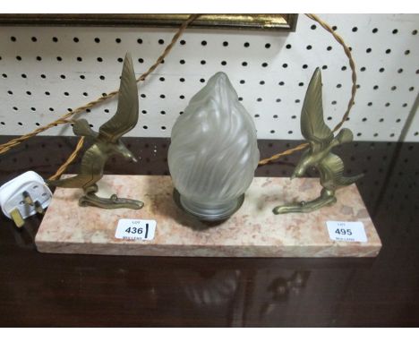 A MARBLE AND BRASS TABLE LAMP with flame shade flanked on each side with birds in flight on a marble base 18cm x 34cm x 10cm